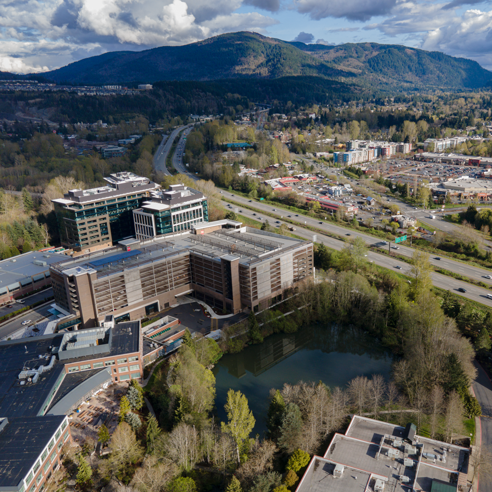 Family reviewing finished kitchen and living area after coordinated home renovation project